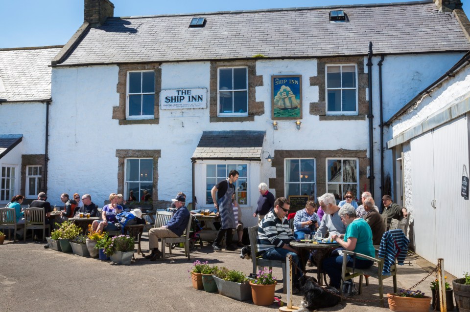 The Ship Inn is found in a horseshoe of whitewashed cottages overlooking the sea