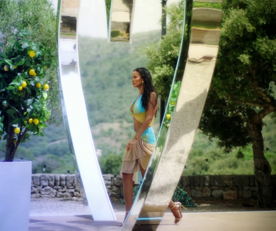 She was shown walking through the famous 'heart arch' in Majorca