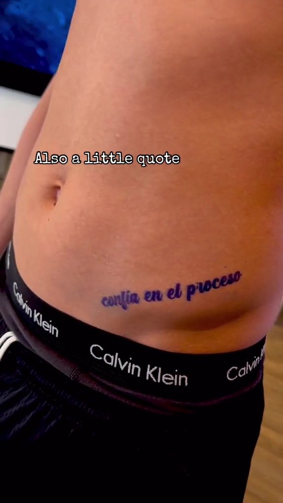 The midfielder also got 'trust the process' written in Spanish on his hip