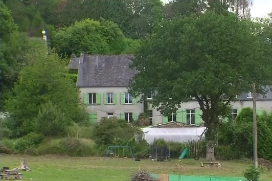 The neighbour's green shuttered house overlooks Solaine's playground