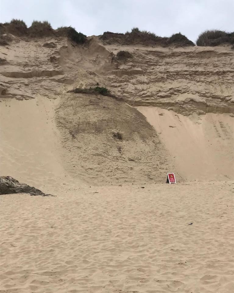 Lifeguards warn the cliff could bury beachgoers alive if it collapses