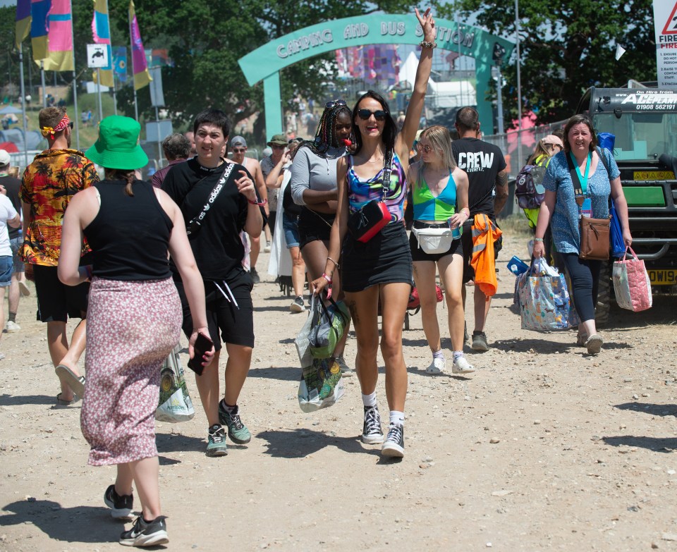 Festival-goers enjoy the heat at the Isle Of Wight Festival today