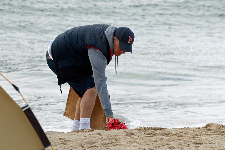 Floral tributes have been left on the beach