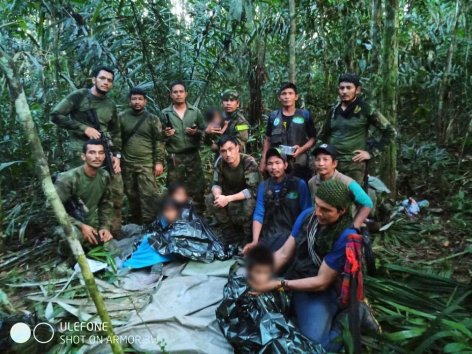 Four children survived 40 days alone in the Amazon rainforest - pictured with Columbian army officers