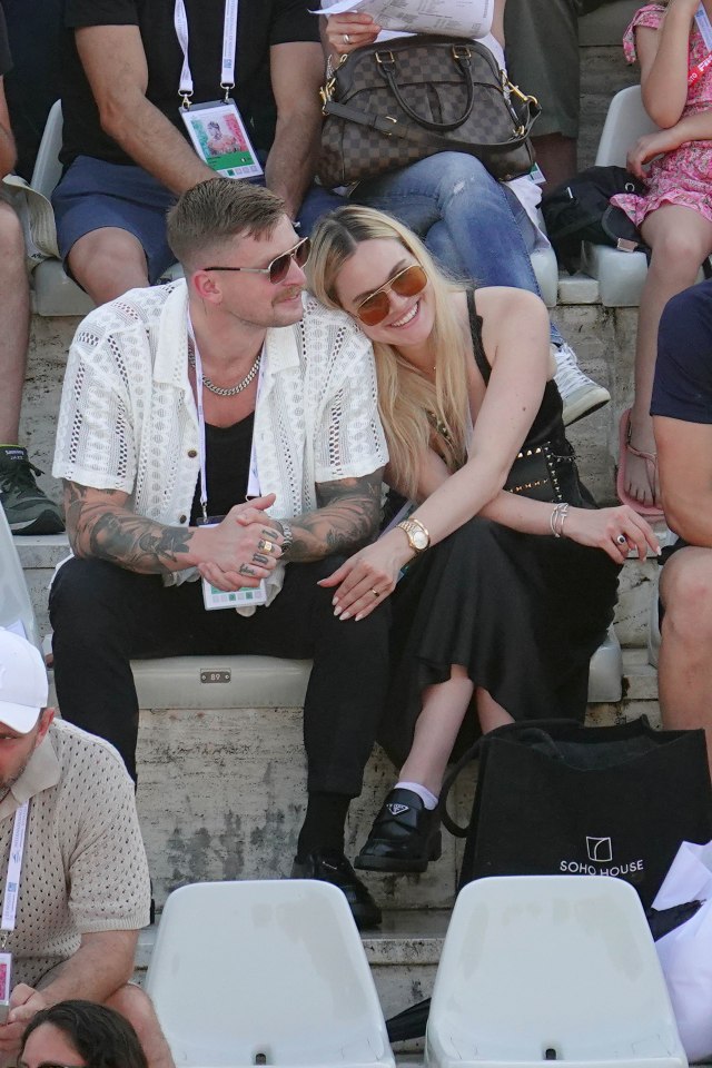 The model and influencer rested her head on her man's shoulder as they attended a swim event