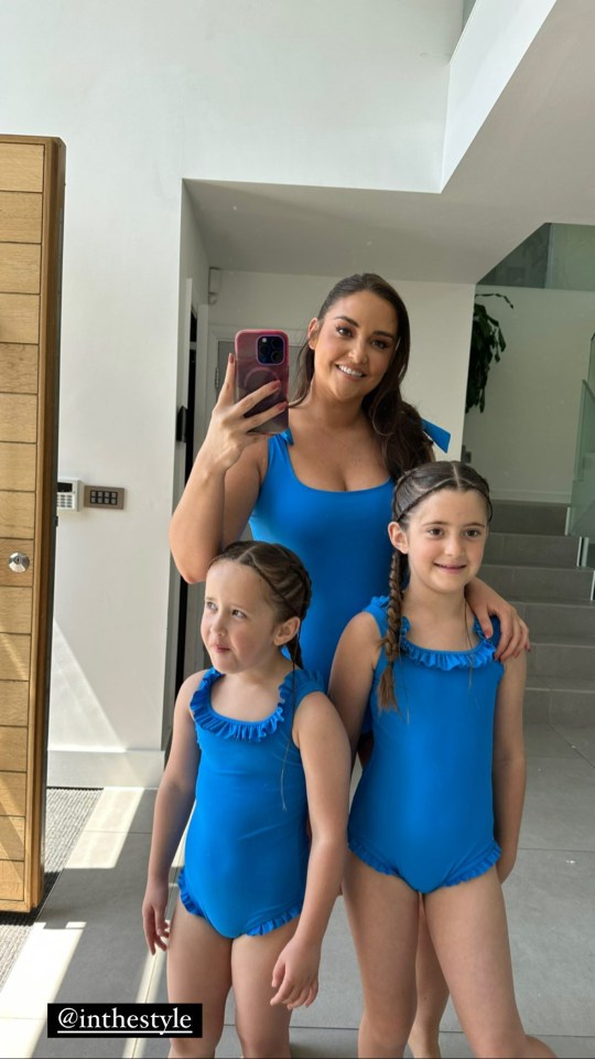 She then posed with her two daughters in matching swimsuits