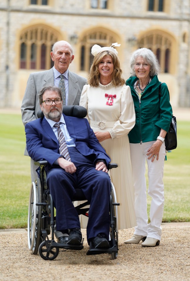 Derek looked very smart in a suit and tie as he watched wife Kate's interaction with William from his wheelchair