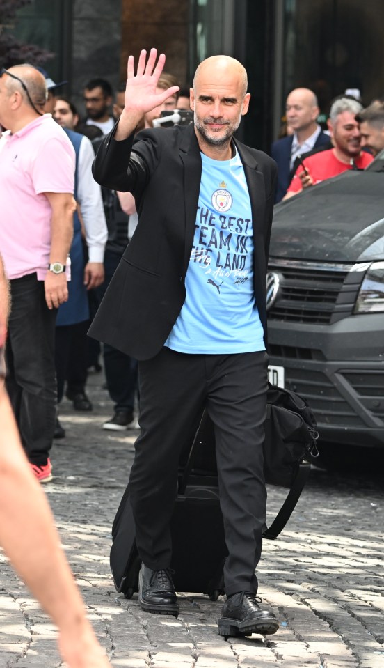 A jubilant Pep waves to fans