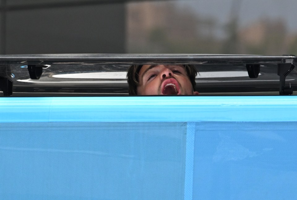 Jack Grealish repeatedly poked his head out of the sunroof of the team bus