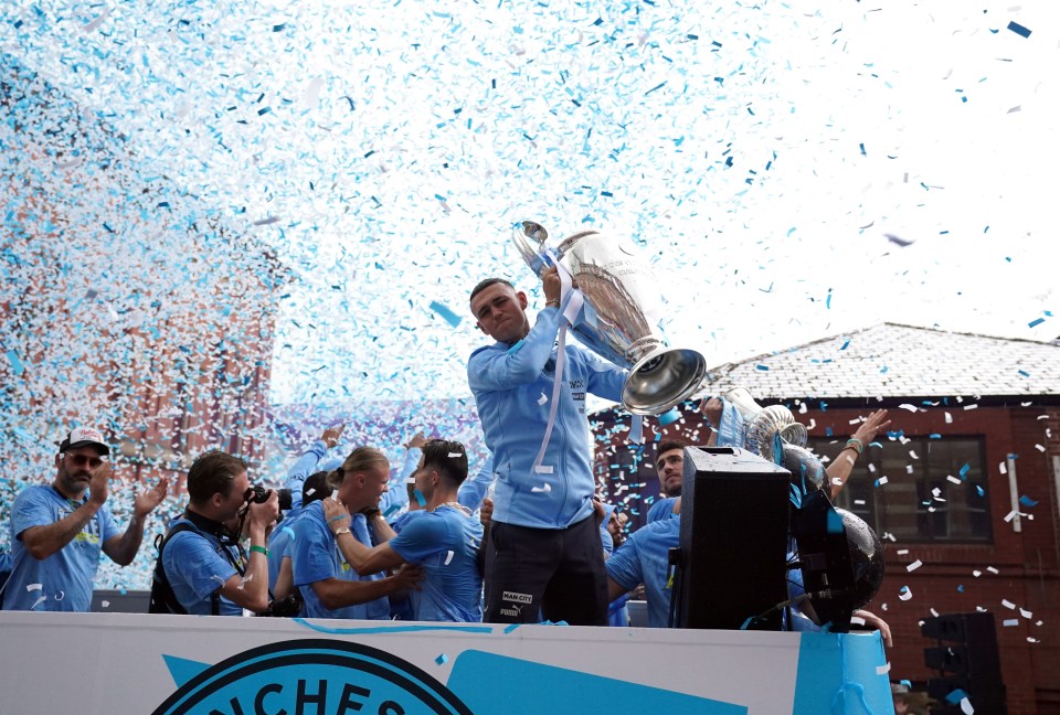 Phil Foden celebrating amid mountains of confetti