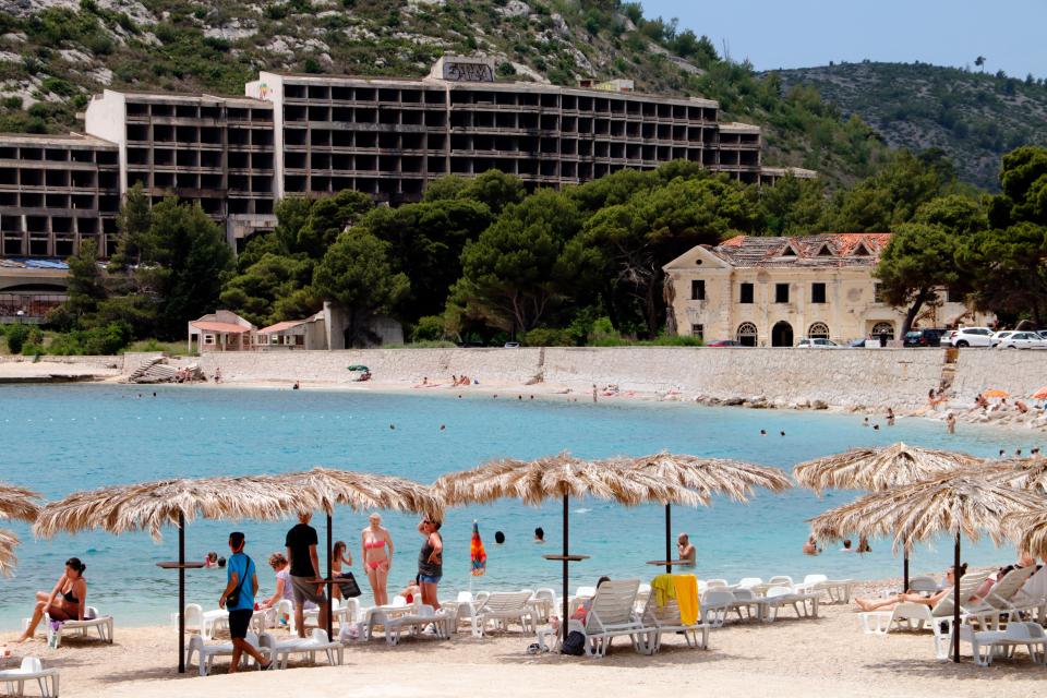 The abandoned hotels provide a creepy backdrop for sunbathers