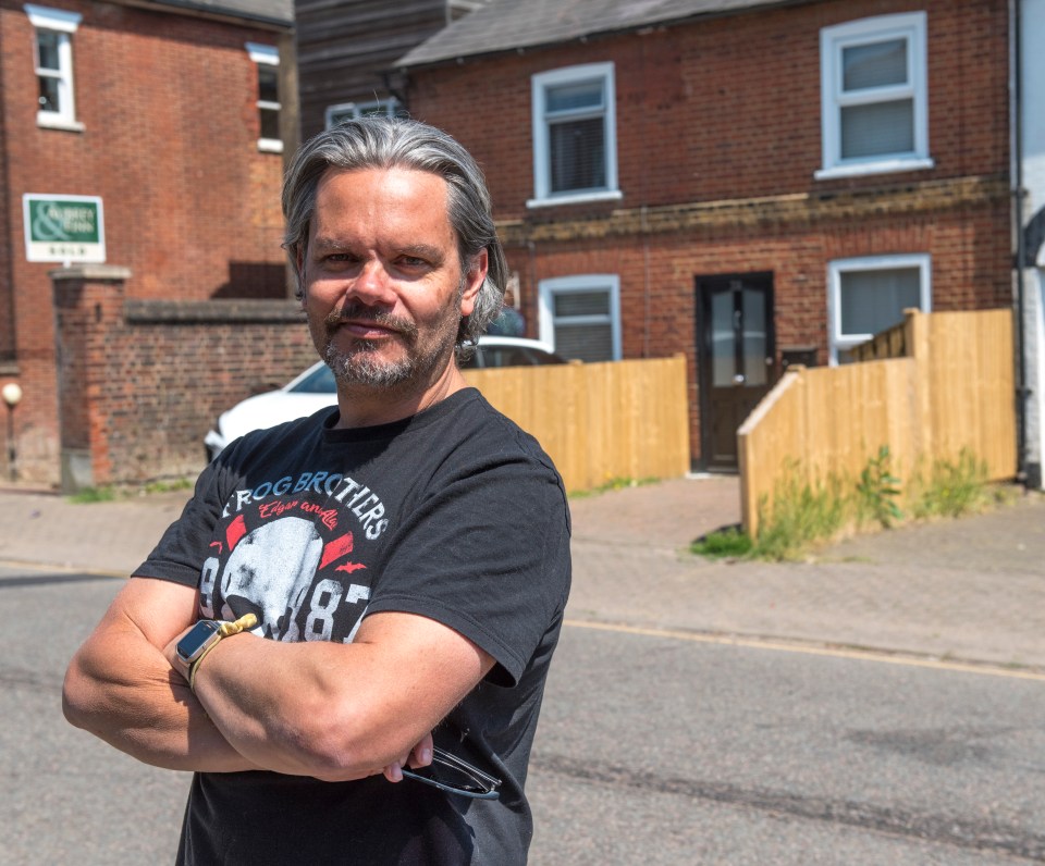 Matt Adams' neighbour has built 'dangerous' fences out the front of his home and says residents aren't happy about it