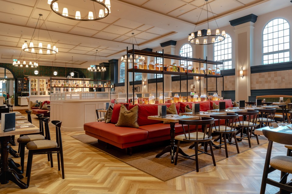 the inside of a restaurant with tables and chairs