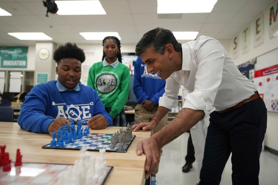 Rishi Sunak is shown a 3D printed chess set during a visit to the Friendship Technology Preparatory High School in Washington DC