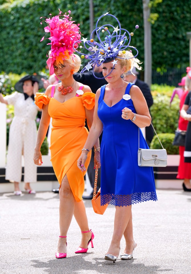 Two pals went bold for their racecourse looks in very bright colours and daring headpieces