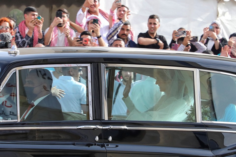 Hundreds of spectators lined the streets to get a glimpse of the newlyweds