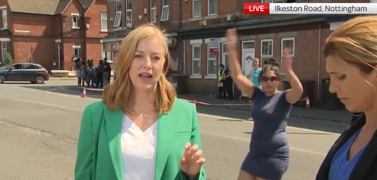 The woman waved her arms and laughed as she interrupted Sky's broadcast