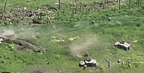 Ukrainian troops can be seen storming Russian trenches