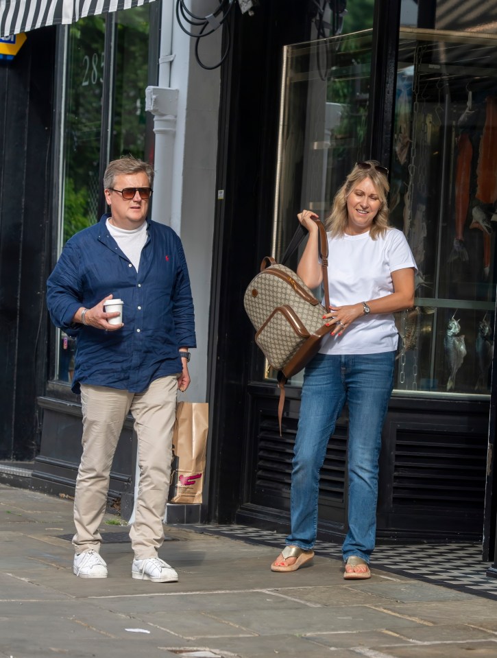 Our exclusive pictures show Aled wearing a less valuable Apple-style watch on Tuesday after he gave up the expensive timepiece