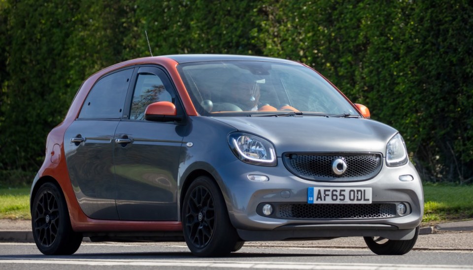 Bicester, Oxon, UK - April 15th 2022. 2015 4 door Smart ForFour car 999 cc car driving on an English country road