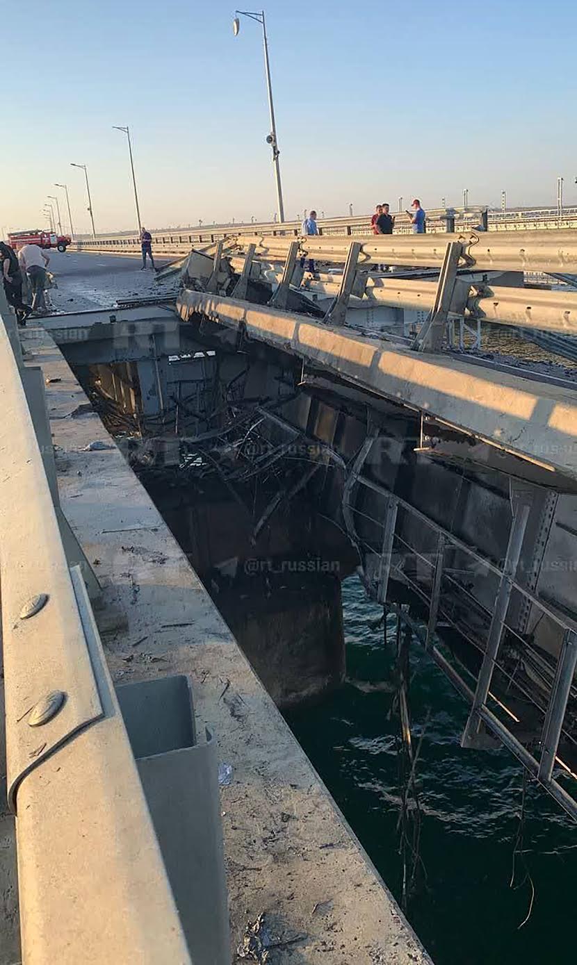 The twisted wreckage of part of the bridge's road section destroyed last July in a Sea Baby drone attack