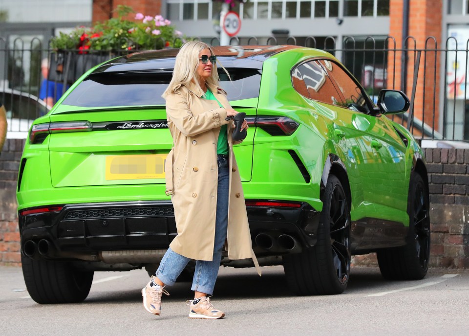 Kerry looked glam in her casual look as she strolled along in a camel coat