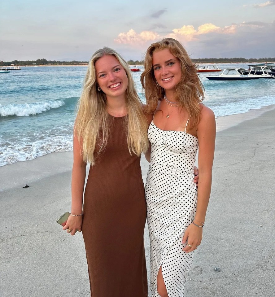 Laura poses for a snap with a pal on the beach in Bali