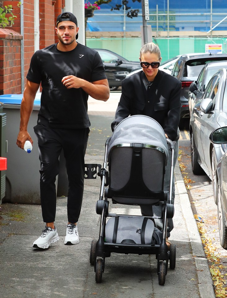 She pushed daughter Bambi in her pram as she walked to a cafe with Tommy Fury