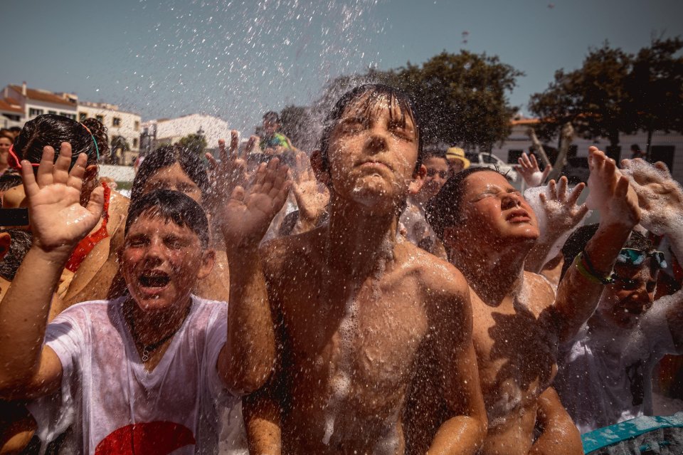 Children played at a cooling down splash party in Es Mercadel, Spain