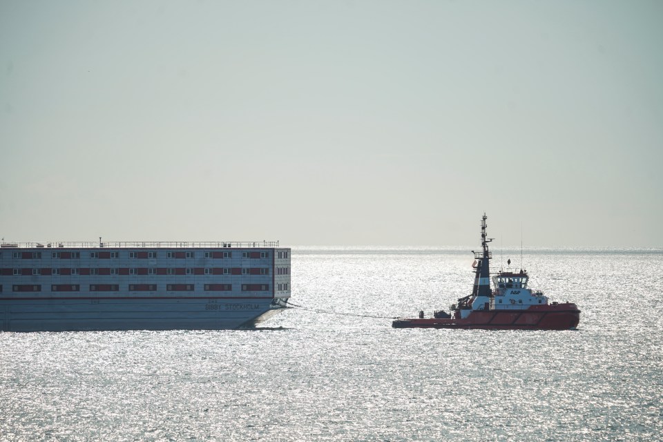 The Bibby Stockholm accommodation barge was towed out of Falmouth to begin its voyage to Portland, Dorset this morning