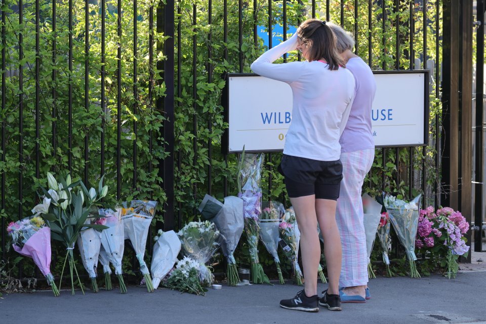 Mourners laid floral tributes outside the school this morning