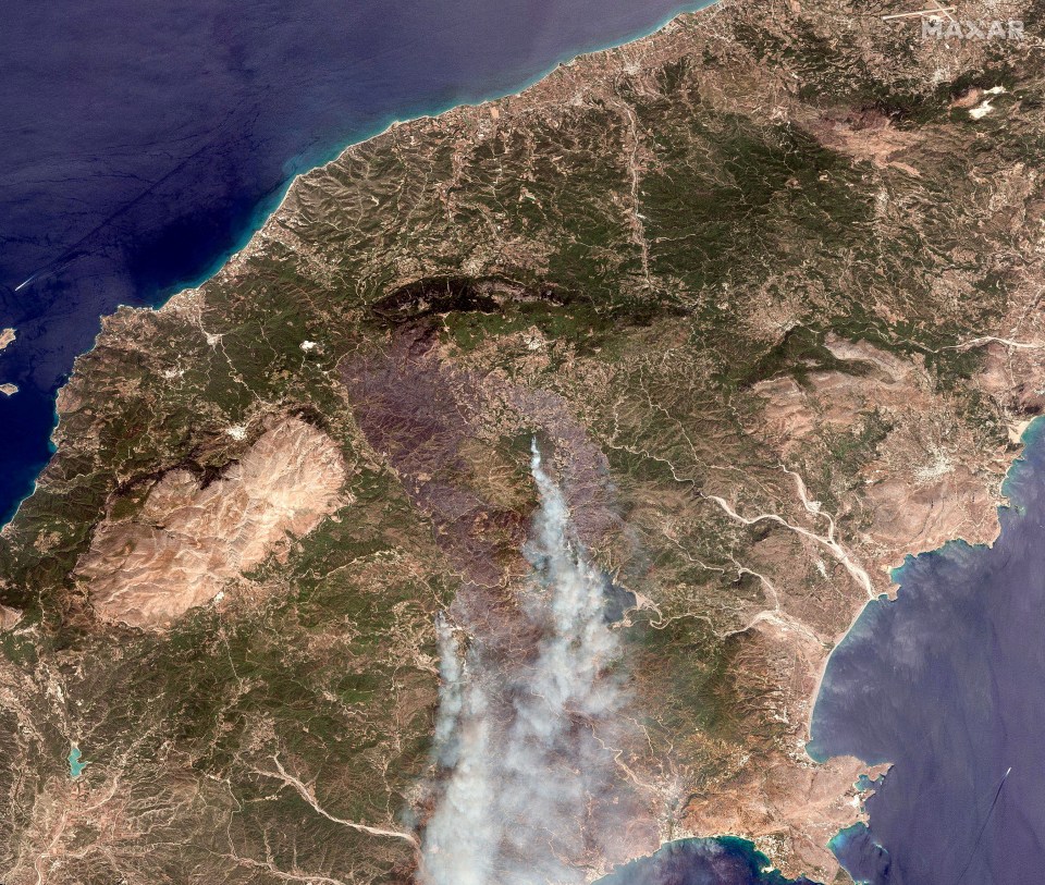 A satellite image showing the Rhodes wildfires