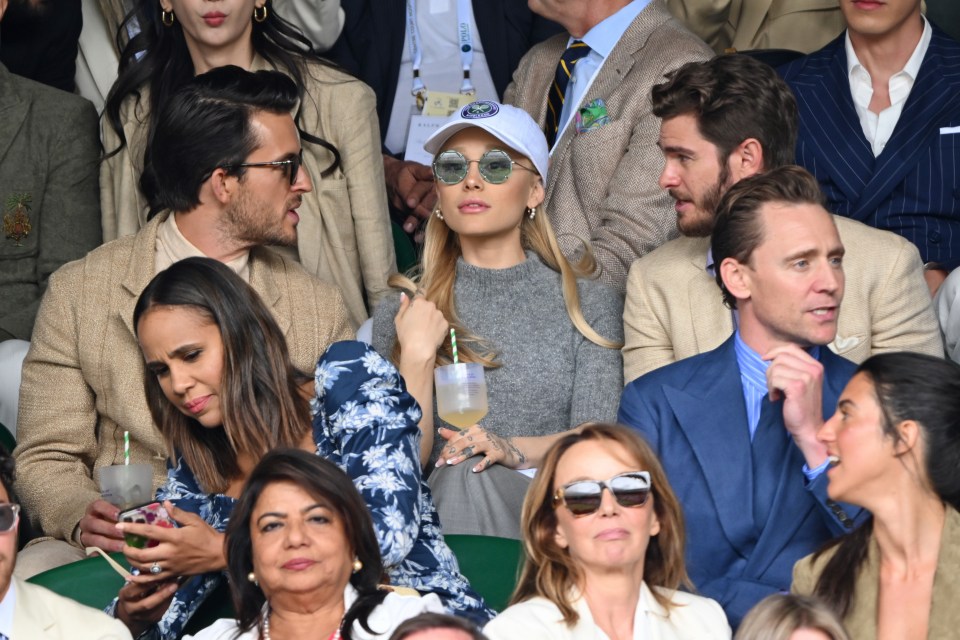 Ariana was surrounded by famous faces which included Jonathan Bailey (left), Andrew Garfield (right) and Tom Hiddleston sitting one row in front