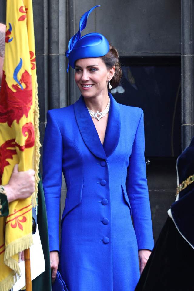 Kate wore a designer coat, hat and the late Queen’s necklace