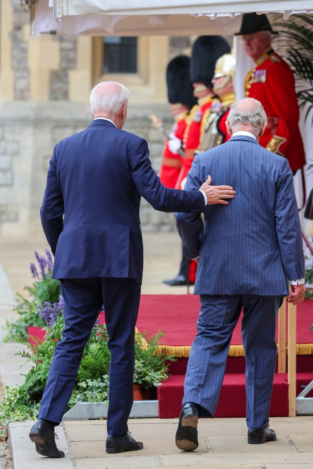 He repeatedly broke royal protocol by placing an unprompted hand on the back of our monarch