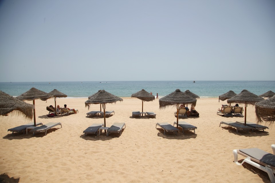 Beaches in Portugal's Algarve region appear deserted in the heat