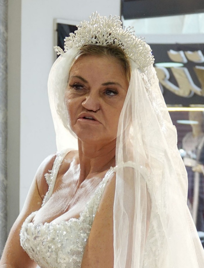 She posed for pictures in a gorgeous wedding gown that featured a long veil and tiara