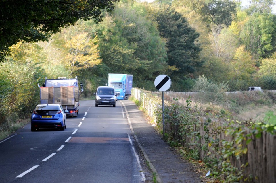 Caption: GV of traffic on Bridge of Weir Road, Brookfield, Johnstone, Renfrewshire, Scotland