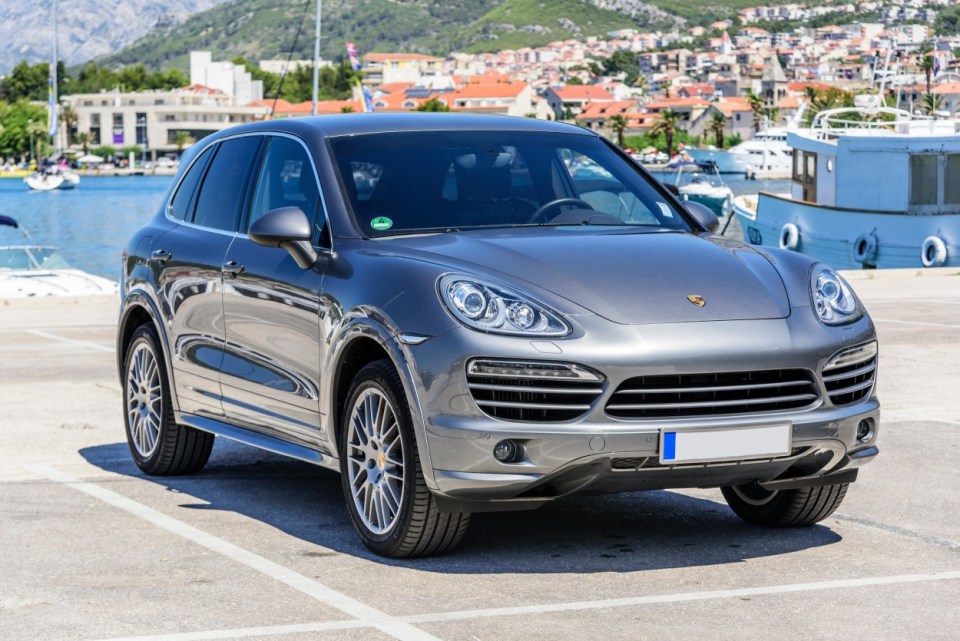 JKHF2B Premium car Porsche Cayenne in the parking lot.