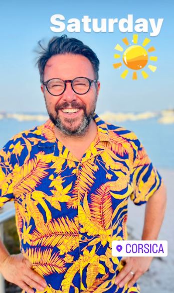 He looked dapper in a brightly coloured outfit at the beach