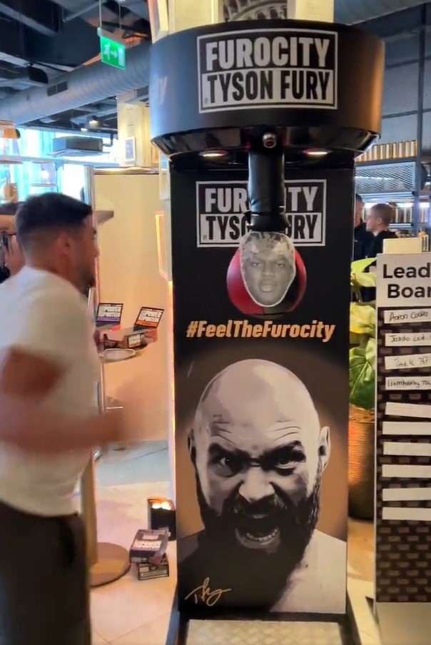 Tommy Fury hit a boxing machine with KSI's face on it