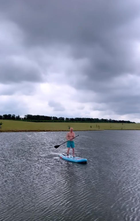 Jake braved the overcast weather to strip off for some paddle boarding