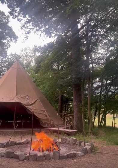 One evening they enjoyed dinner in a huge tent with a roaring open fire