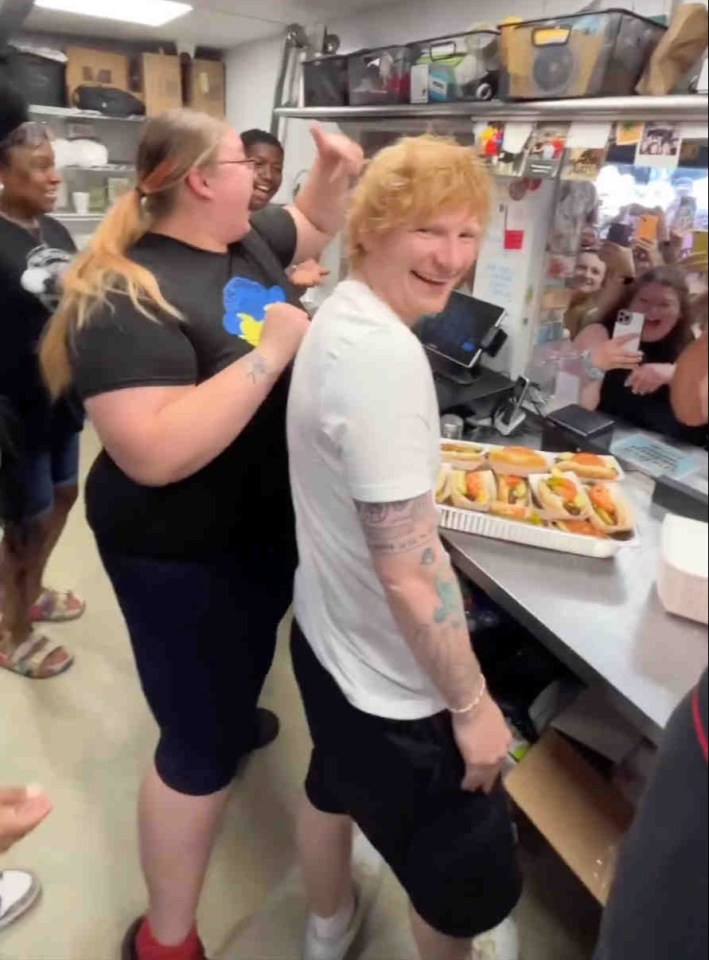 Ed Sheeran  serving customers at The Wieners Circle, known for 'high-quality street food with a side of insults'