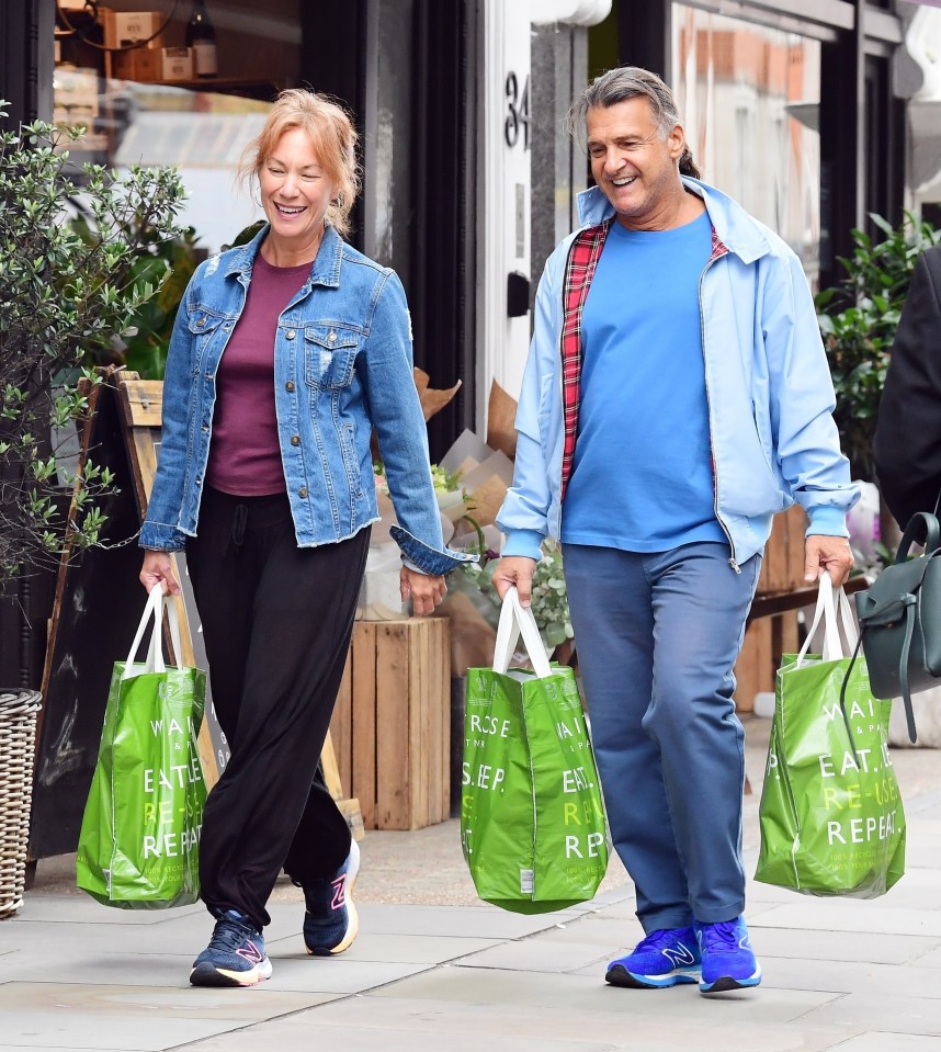 Scott and Tanya looked in high spirits as they walked the streets of London