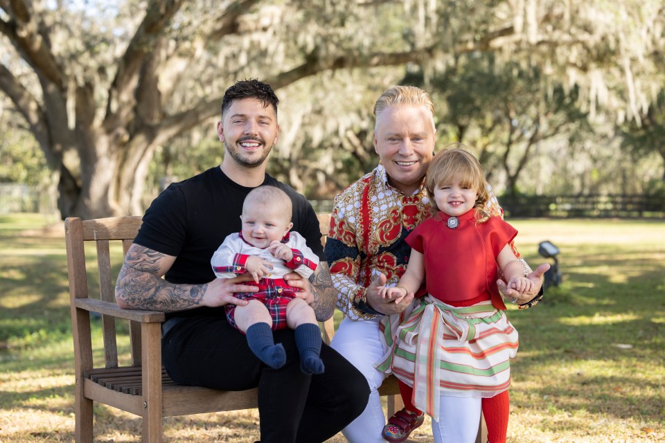 The dad-of-eight, pictured with fiancé Scott and their two children, is famed for spoiling his brood rotten