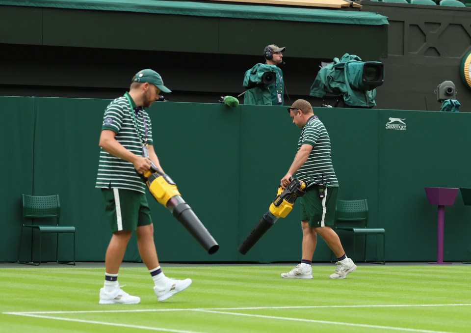 Leaf blowers were used to dry the Centre Court surface at Wimbledon