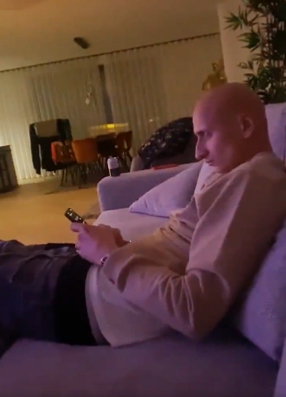 The woman posted a short video of Shelvey and Wood on the sofa with her