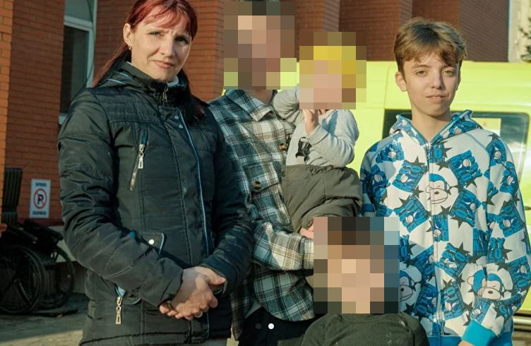 Vitaliy (far right) returned to his mum and family in Kyiv after six months in a Russian camp