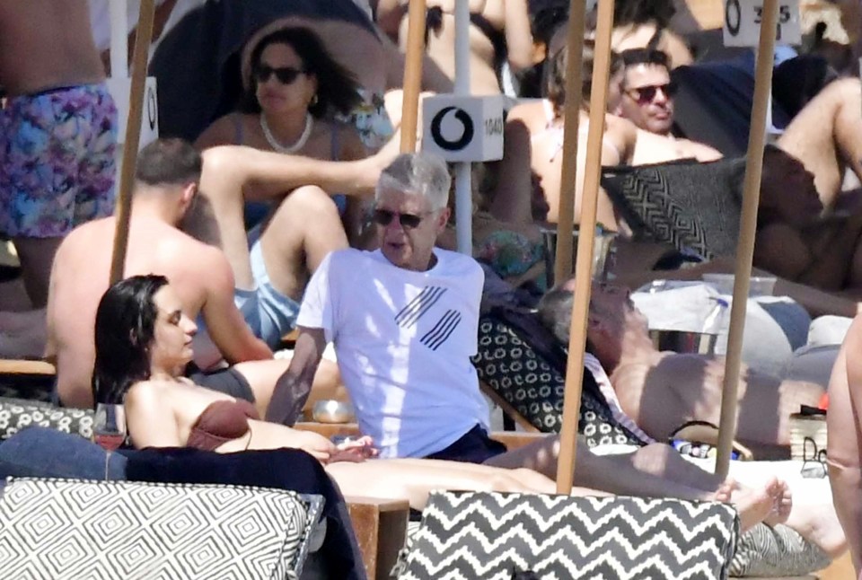 Arsene Wenger was pictured alongside a mystery brunette on holiday